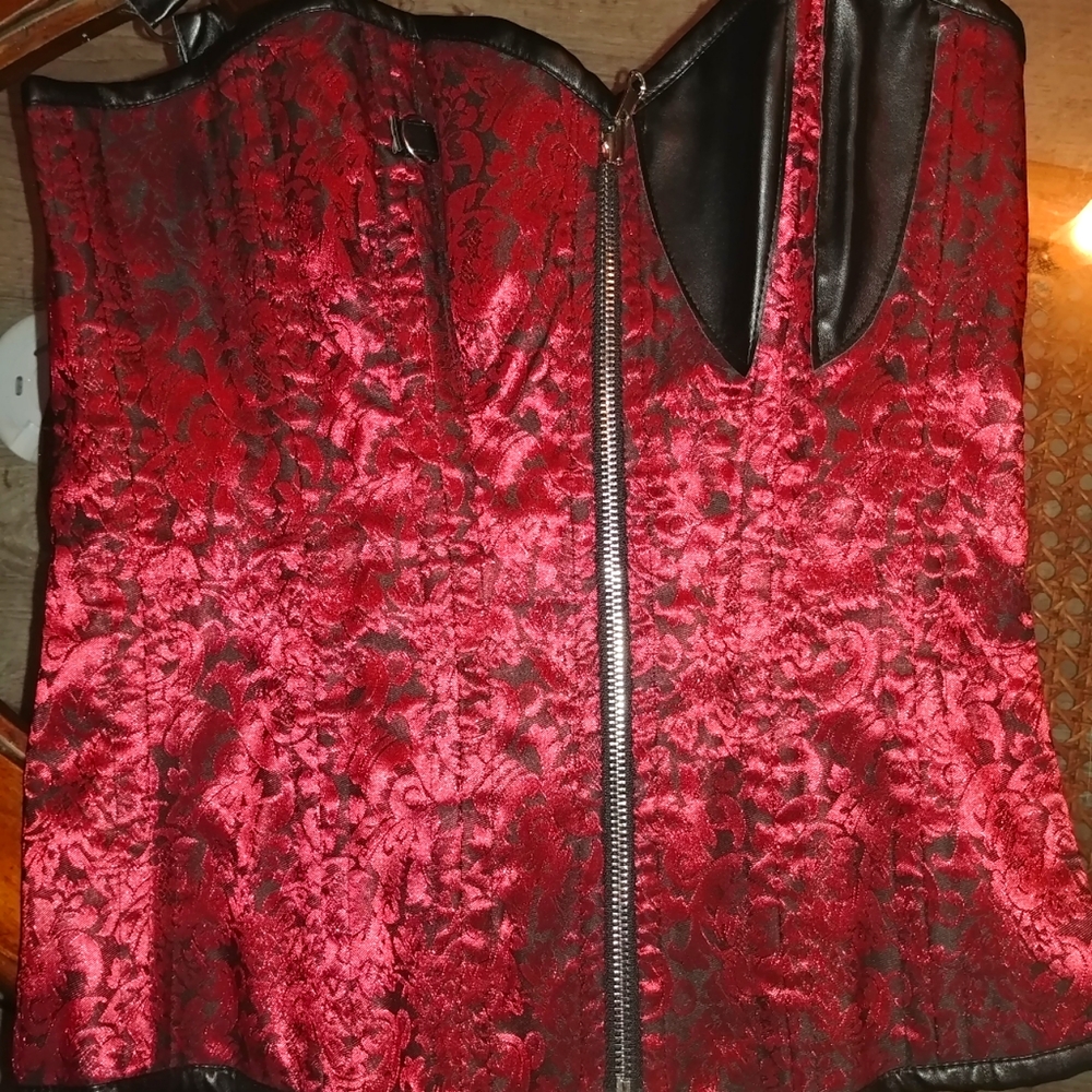 Unsure of brand. The size is medium. Its a deep red swirls and then black
